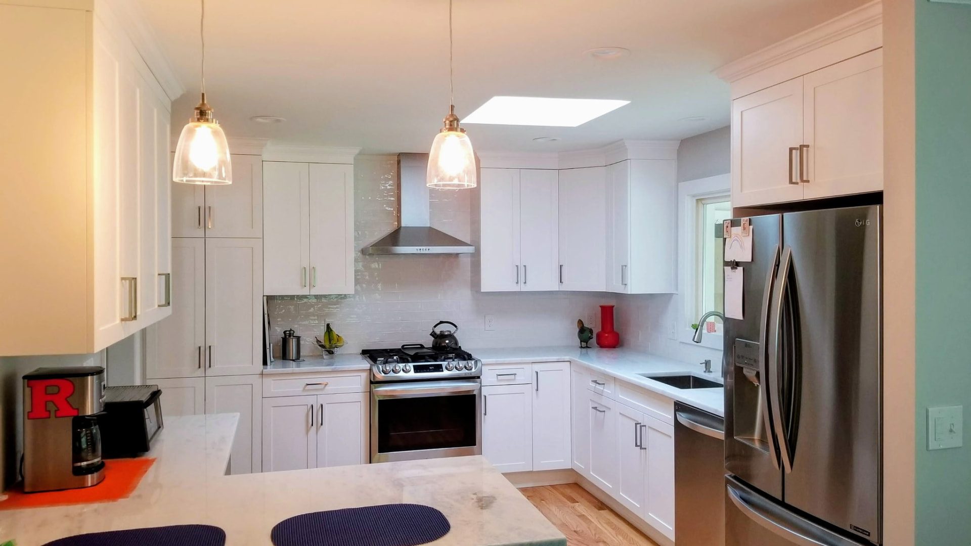 White Shaker-style kitchen cabinetry with tall pantry storage in a historic Ridgefield, CT home.