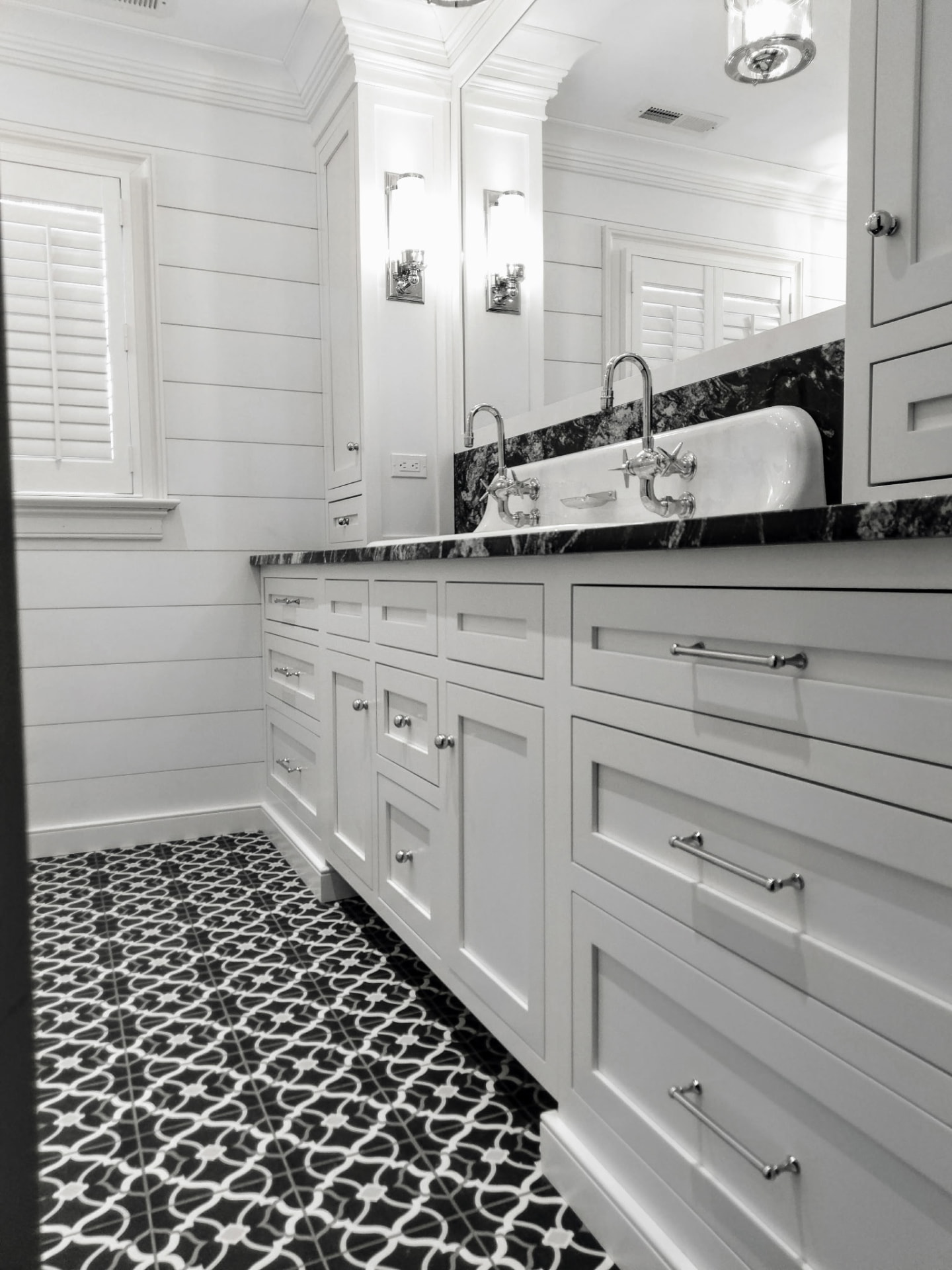 Custom white built-in bathroom cabinetry and vanity in a Ridgefield, CT home