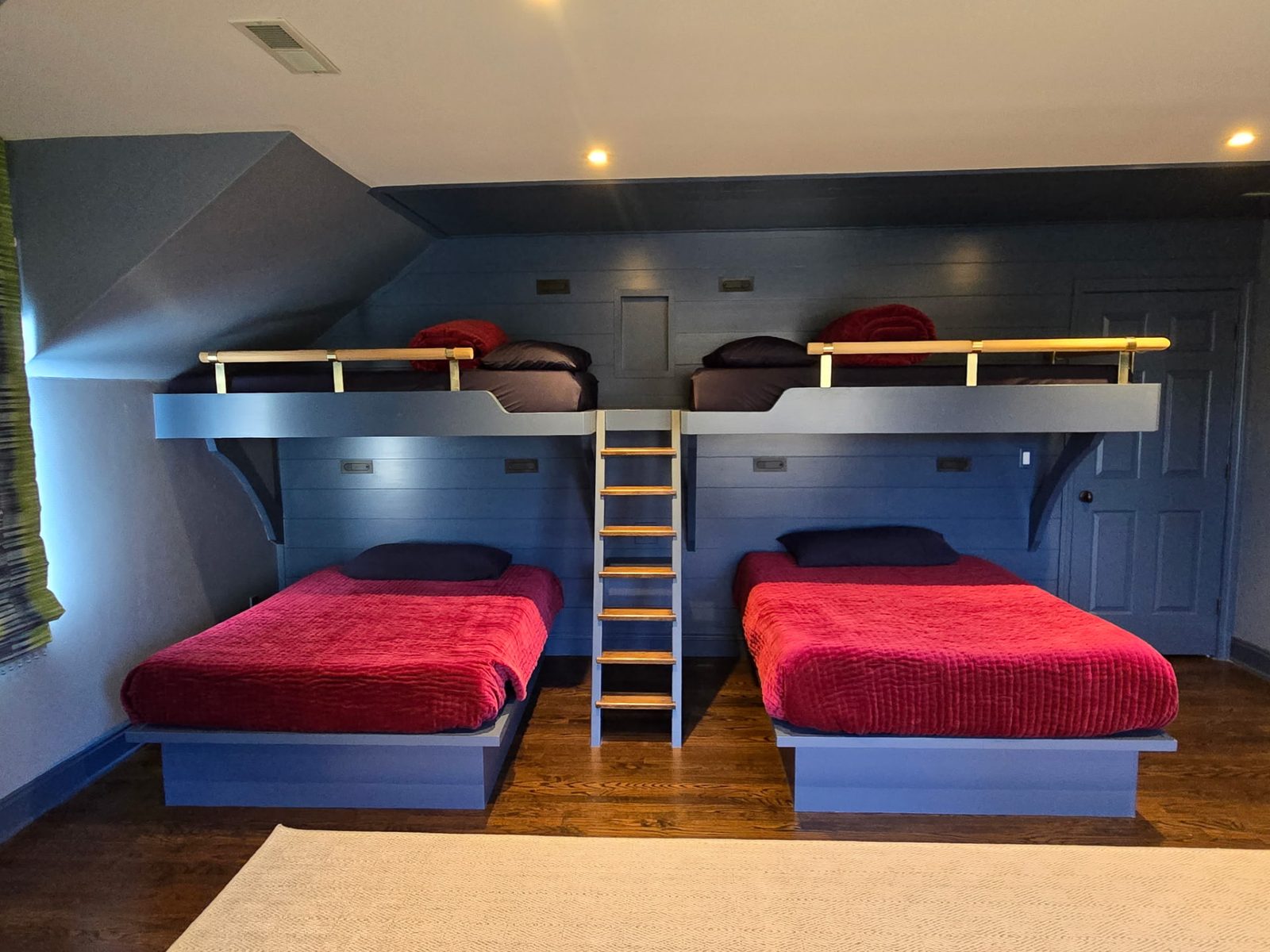 Full view of custom built-in bunk beds for four with integrated lighting in a New Canaan, CT home